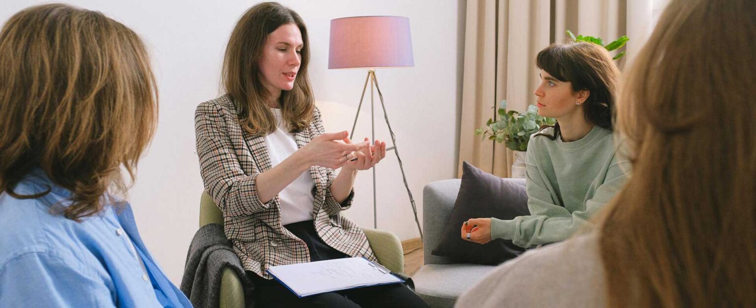 People talking together in a warm room